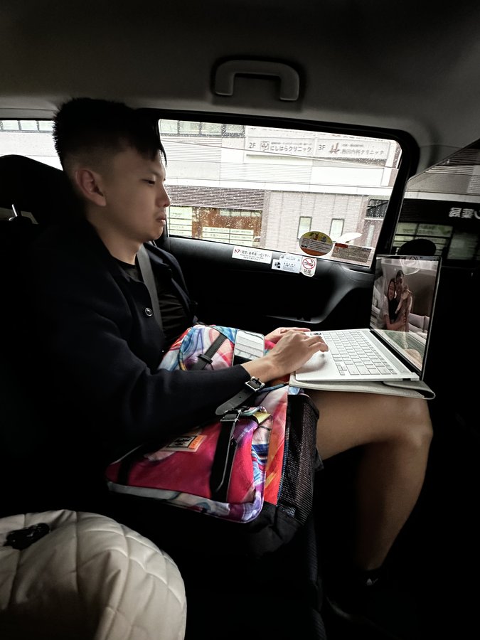 Backseat. Calls on the way to meetings.